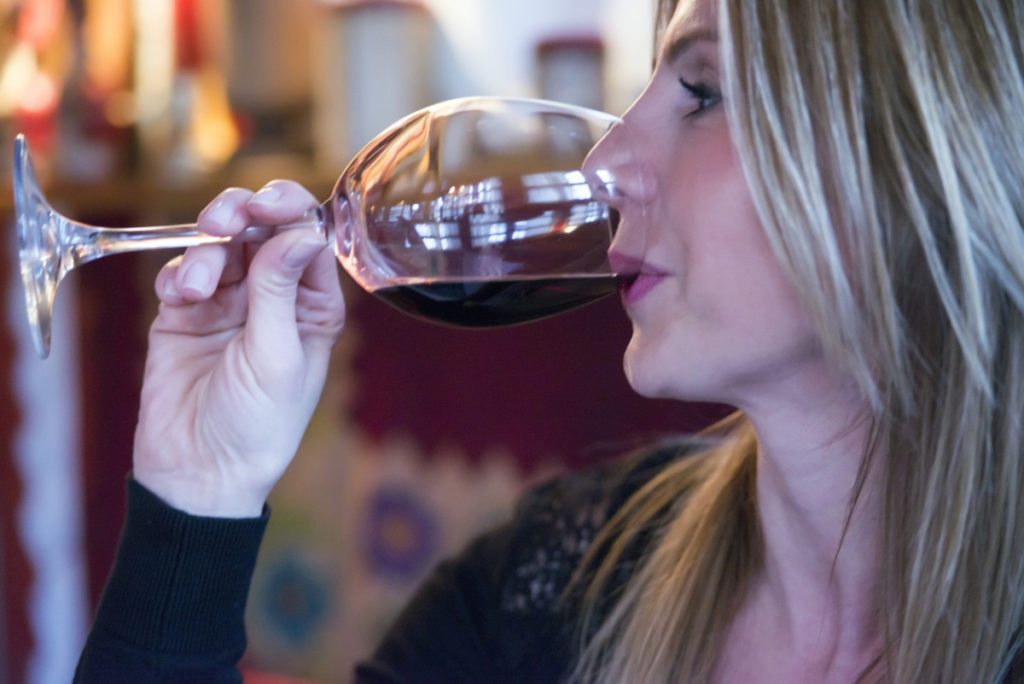 woman tasting wine
